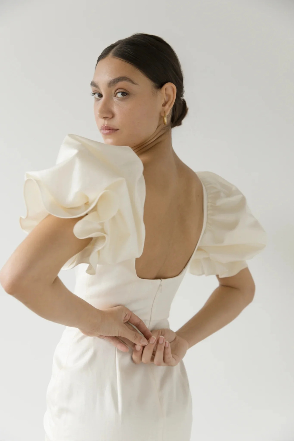 Woman in dress by British wedding dress designer Clover London