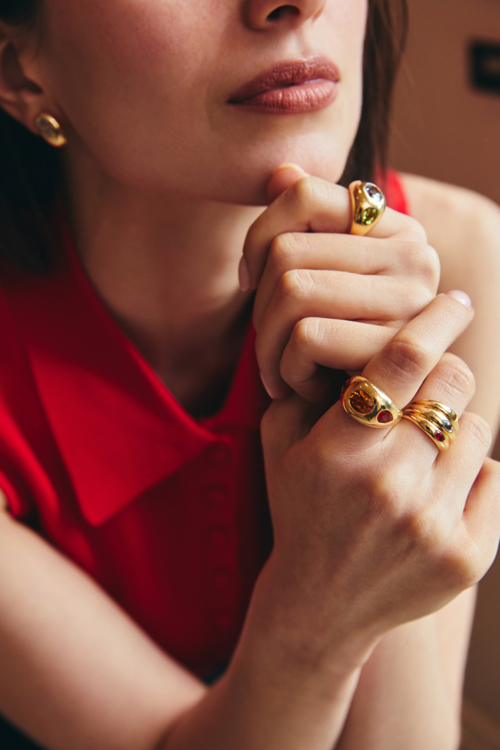 Woman clasping hands in front of her
