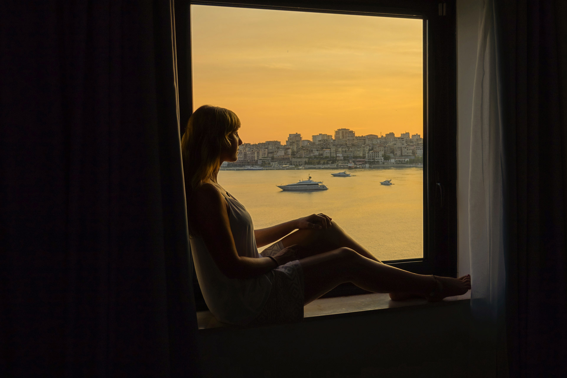 Woman looking out the window at