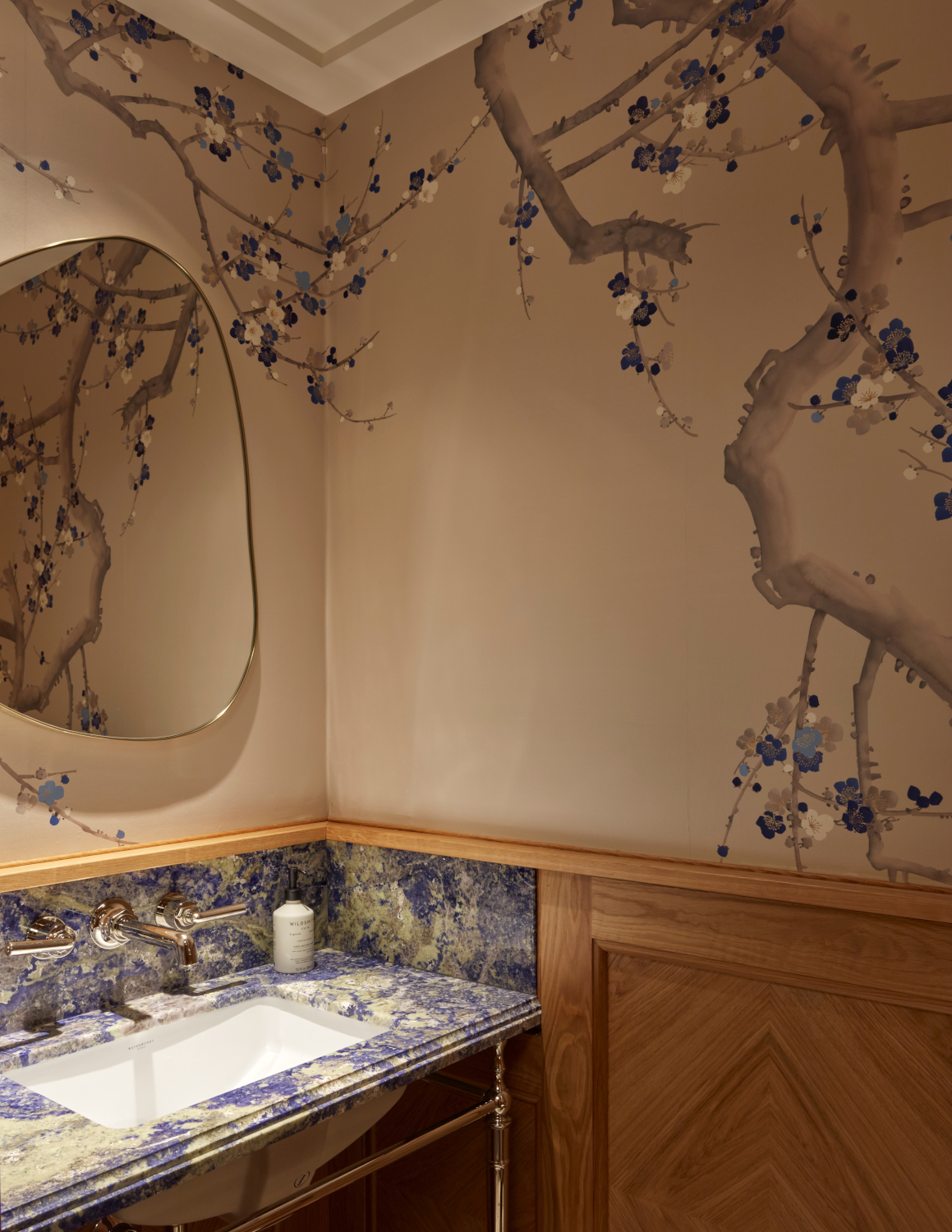 Bathroom sink with marble and wood accents