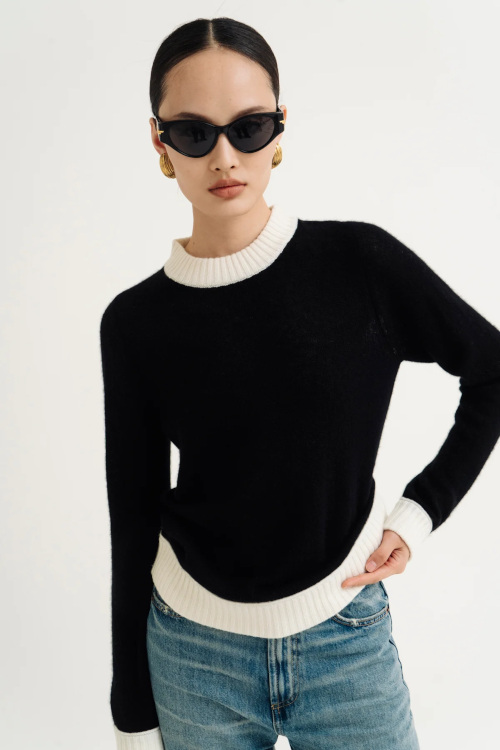 Woman in black and white jumper