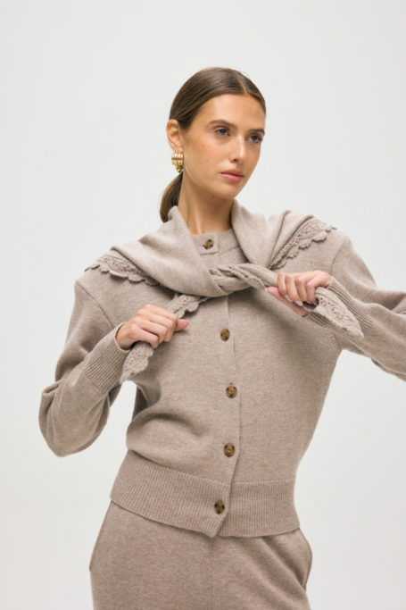 Woman wearing cardigan and scarf