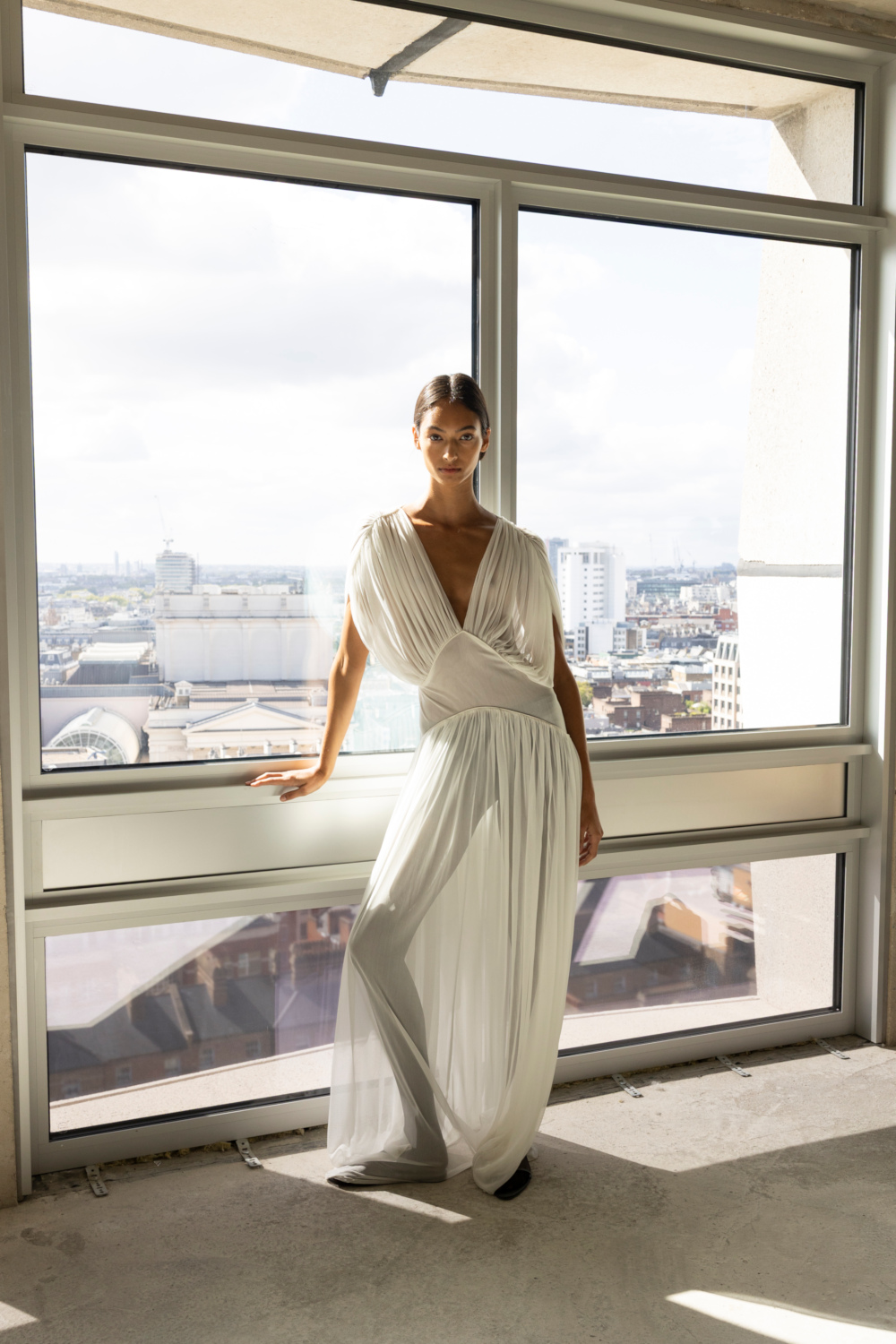 Woman in white sheer dress