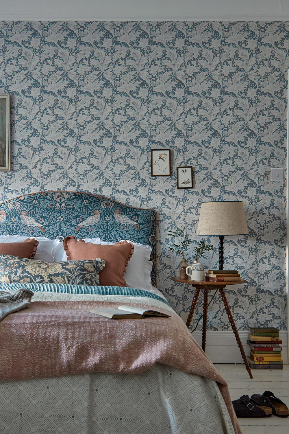 Bed with wallpaper behind it