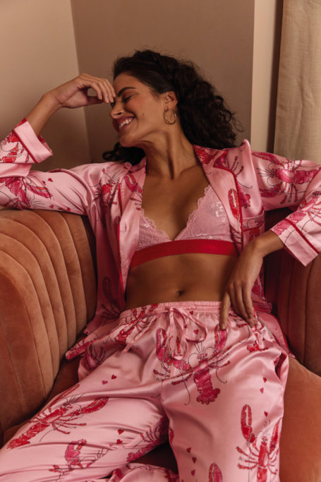 Woman wearing pink pyjamas