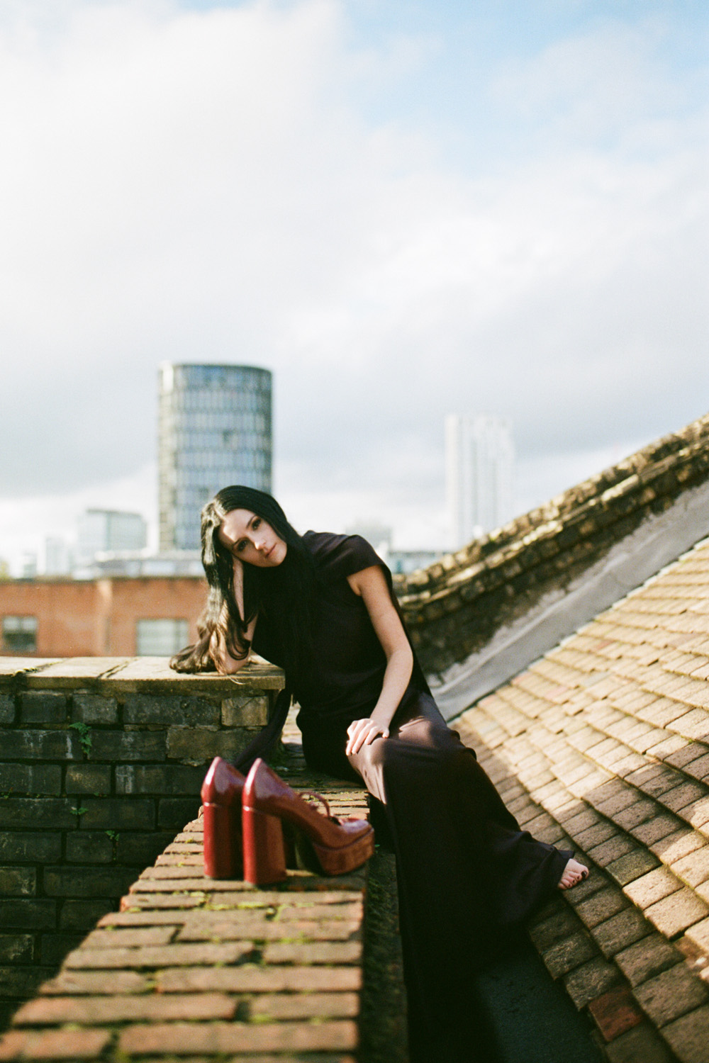 Posy Sterling sitting on a London rooftop