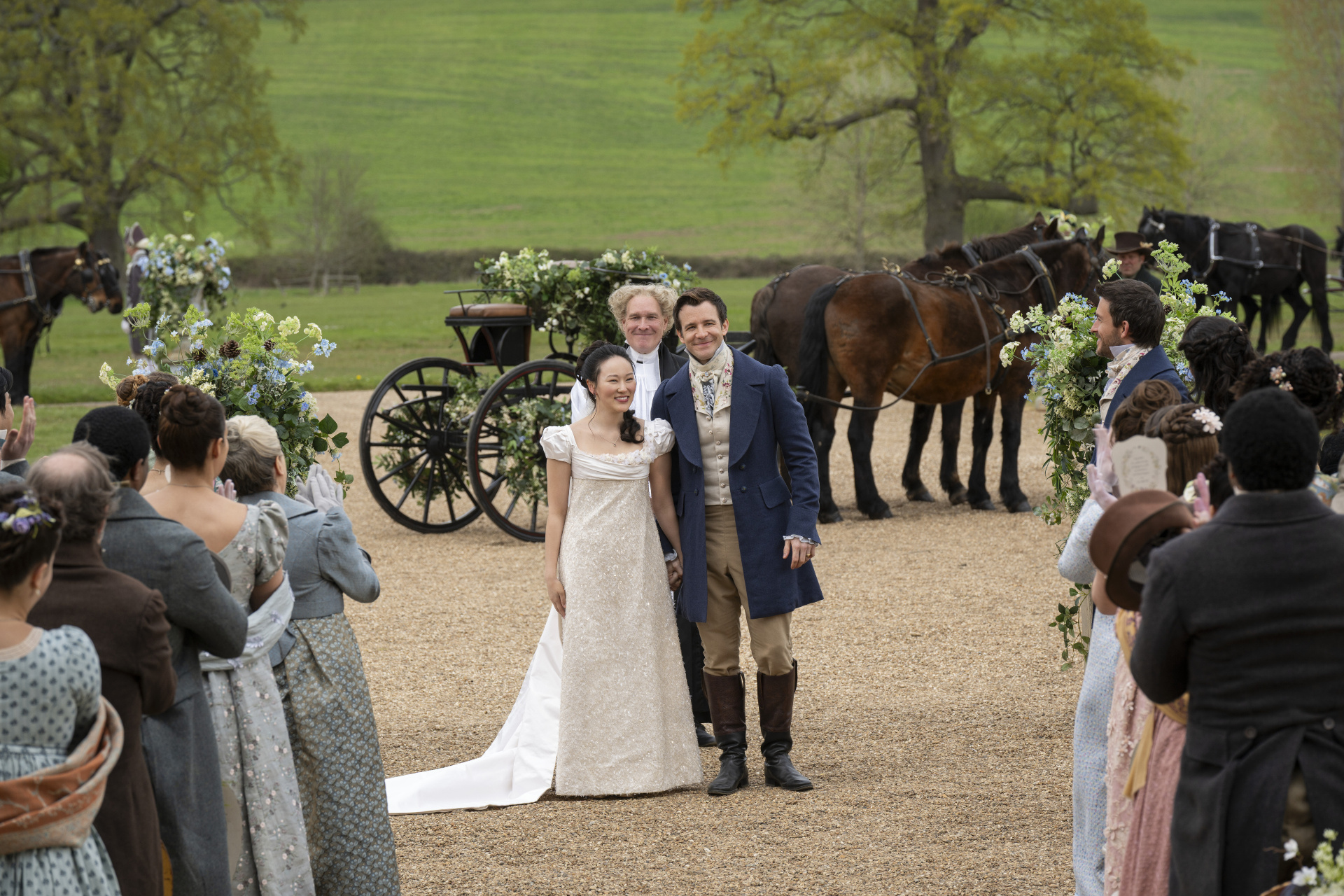 Yerin Ha as Sophie Baek in her wedding dress and Luke Thompson as Benedict Bridgerton in his groom outfit in Bridgerton season 4