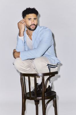 Darragh Hand crouching on a chair