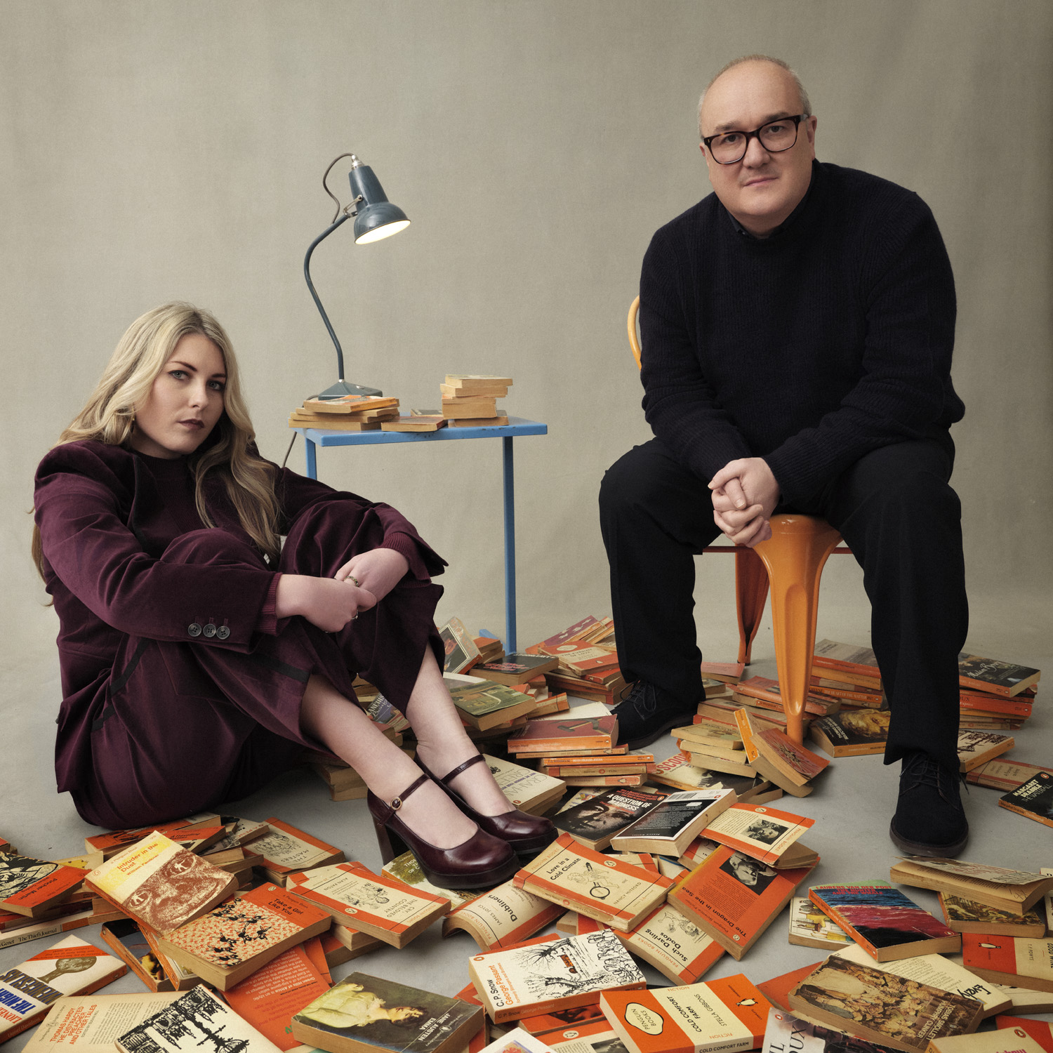 Tabby Syrett & Dominic Sandbrook surrounded by books