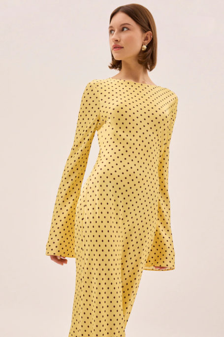 Woman in yellow polka dot dress
