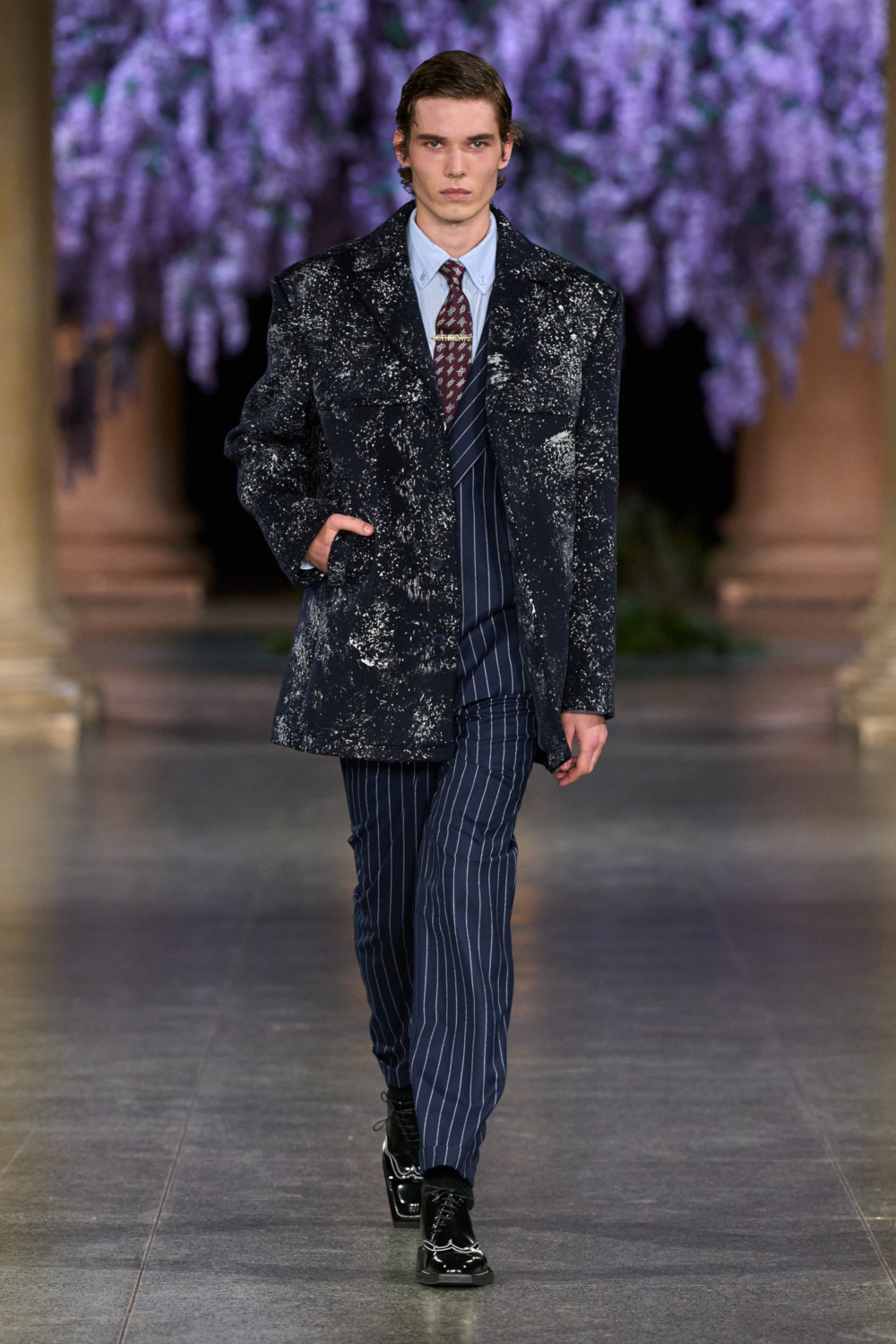 Model wearing MITHRIDATE AW26 on the runway