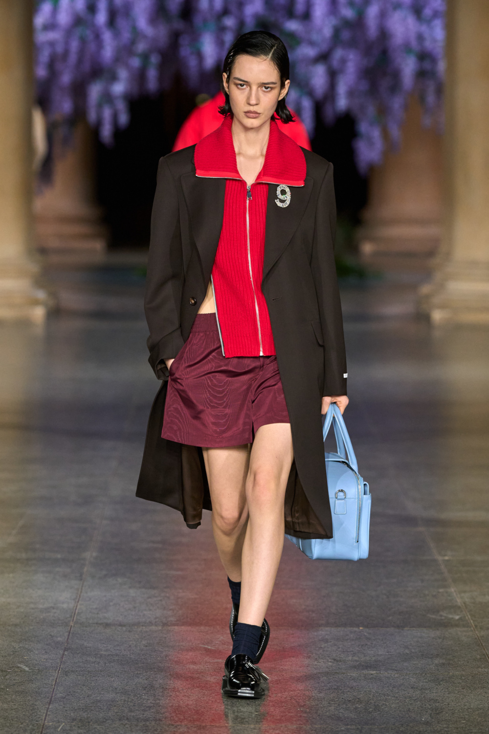 Model wearing MITHRIDATE AW26 on the runway