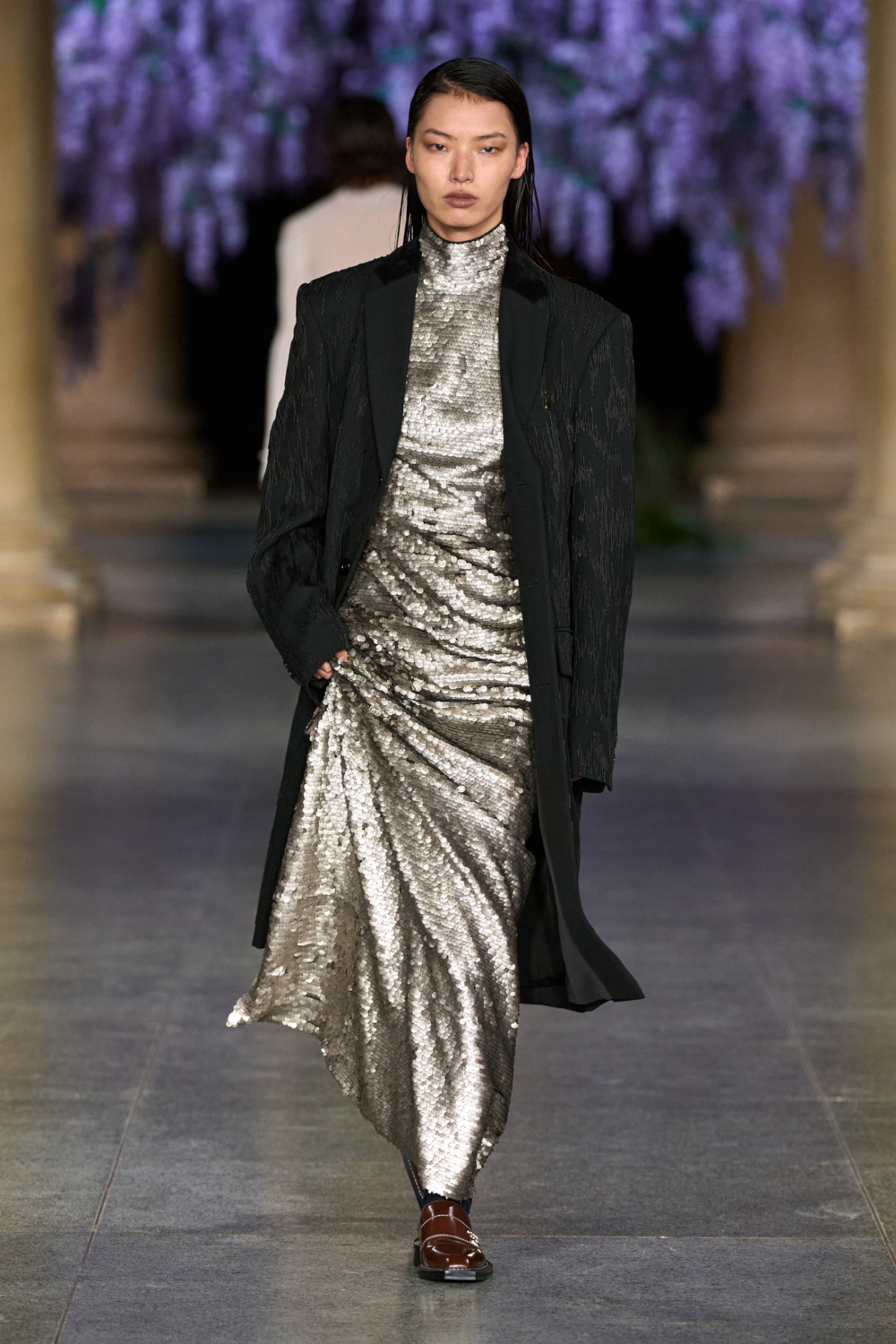 Model wearing MITHRIDATE AW26 on the runway