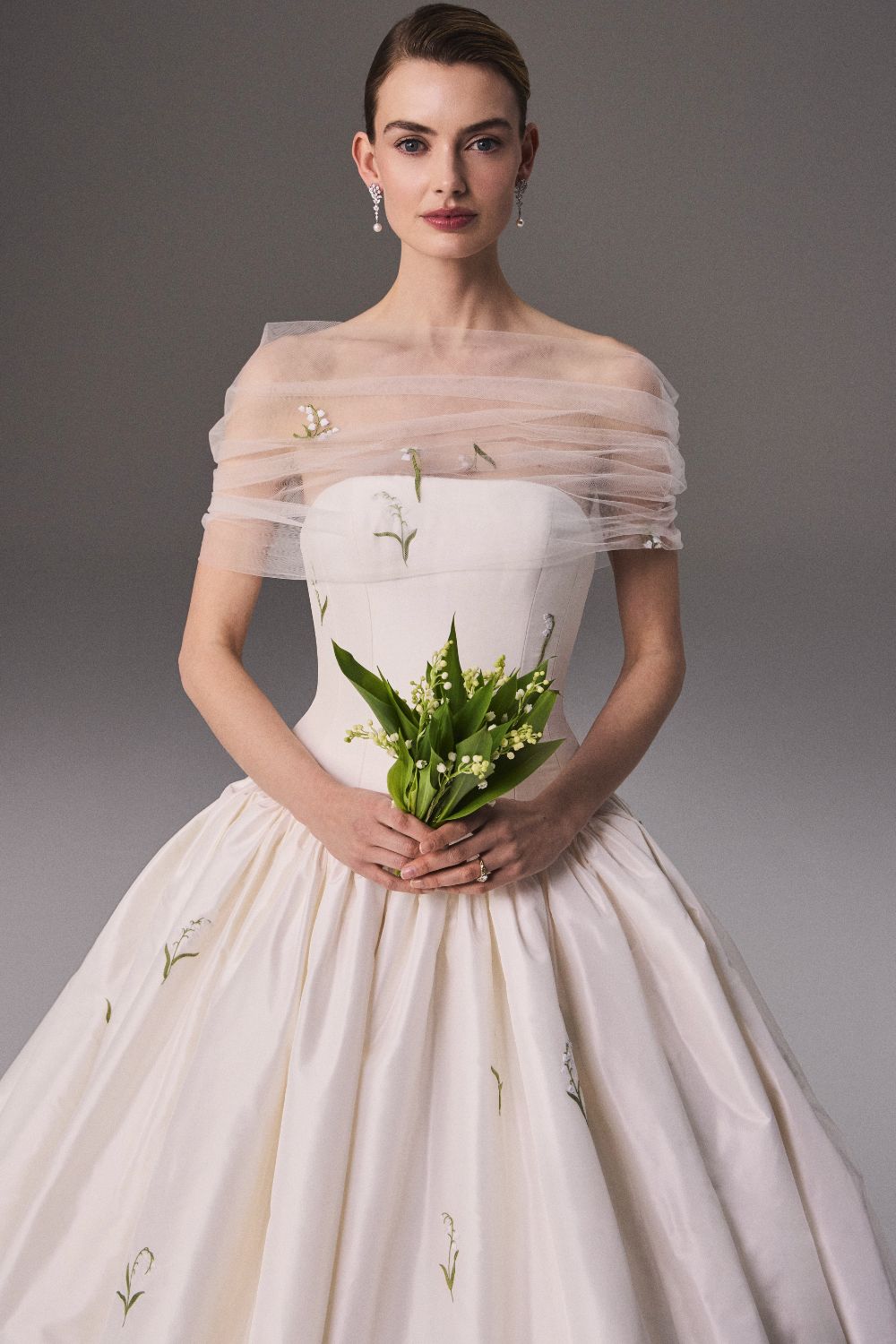 Bride wearing sheer shawl