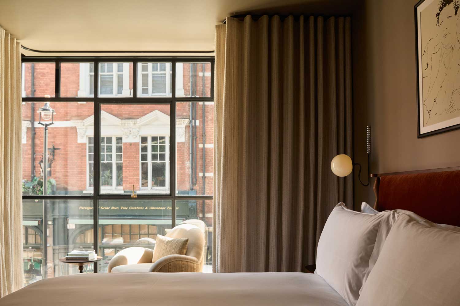 The Newman hotel bed with a view over Newman Street