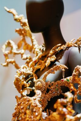 Close up of gold jewellery sculpture on mannequin