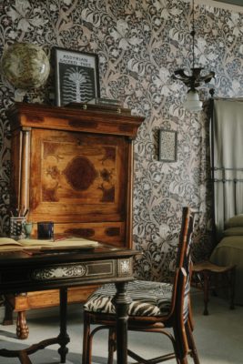 Bedroom with black wallpaper