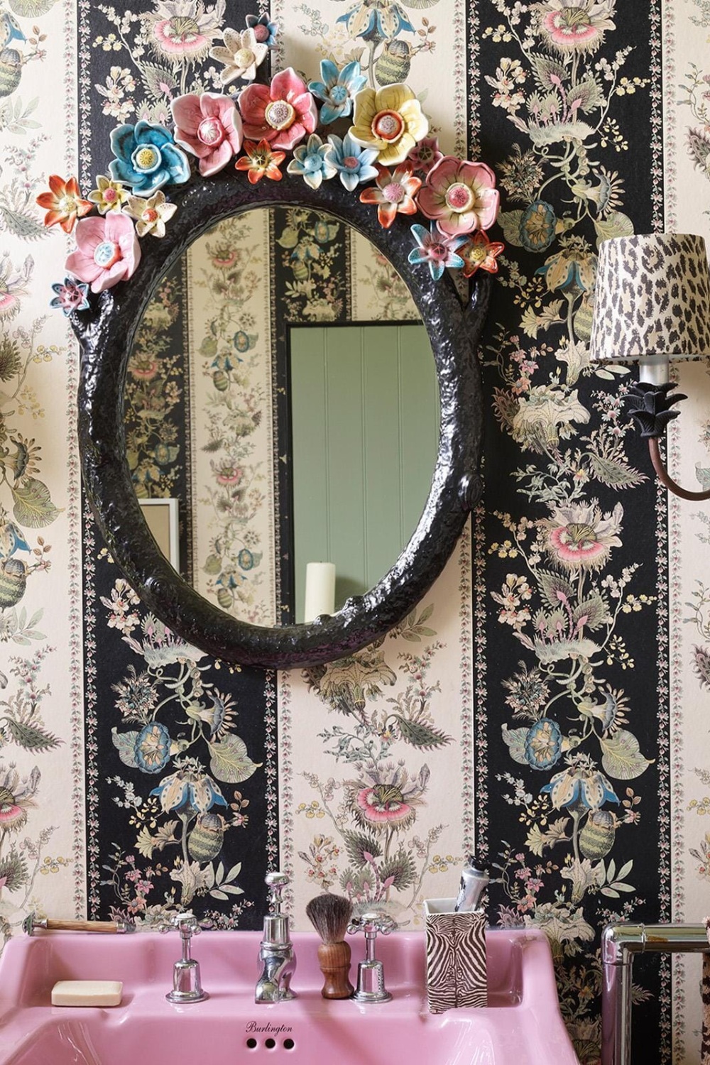 Bathroom with striped walls and pink sink