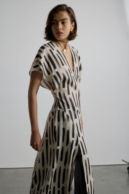 Woman wearing black and white striped dress from AKYN