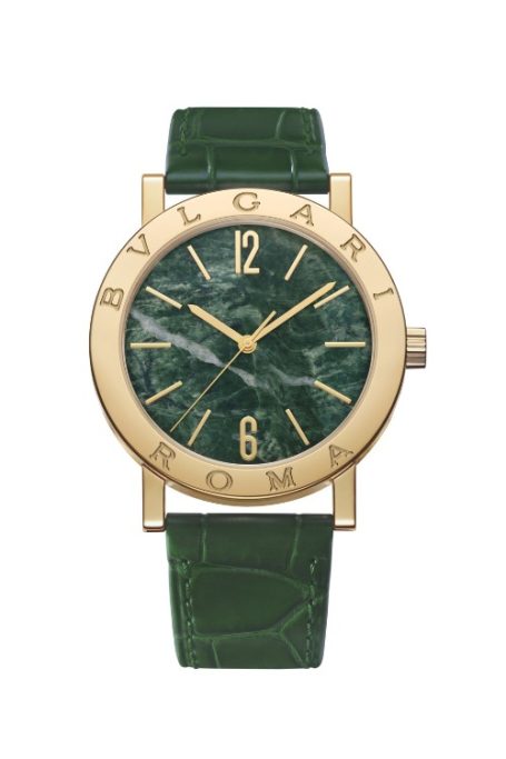 Gold timepiece with green face and strap