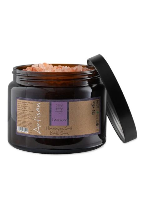 Bath salts in black glass tub