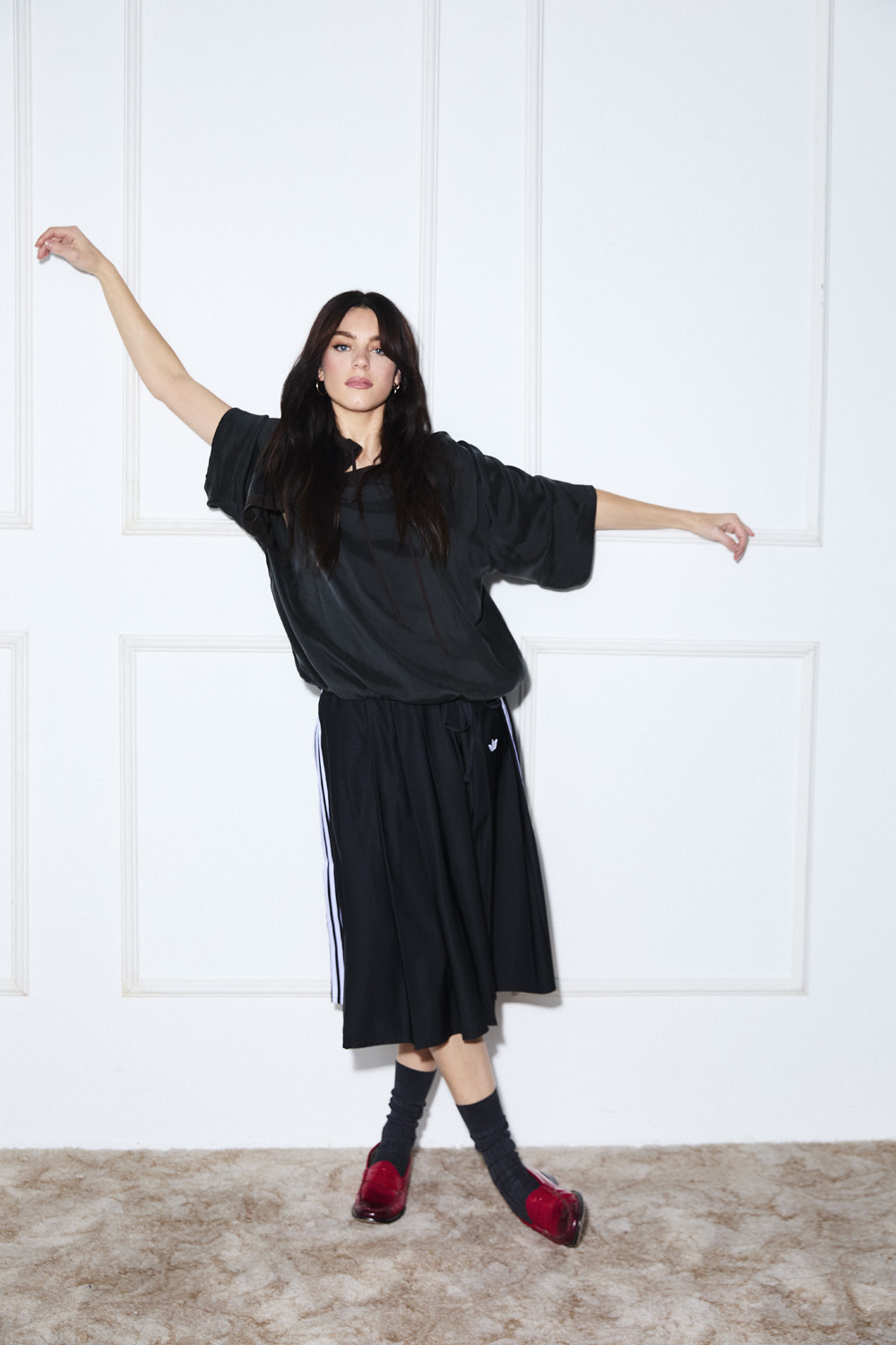 Holly Cattle leaning against a white door