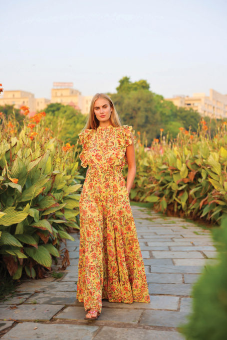 Woman wearing yellow sun dress from Aspiga | female founded british fashion brands