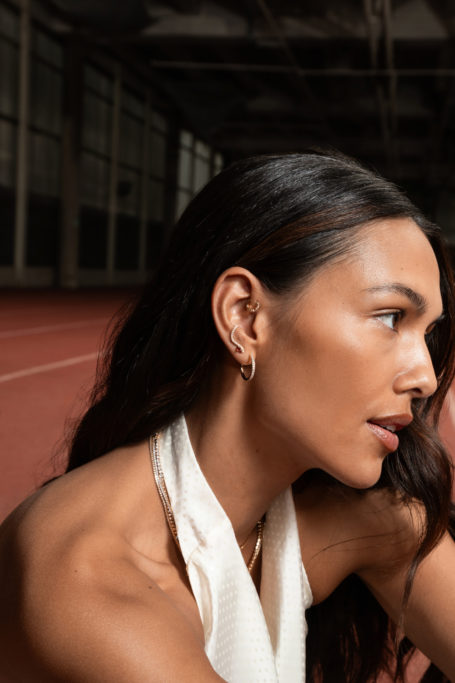 Close up of woman wearing jewellery from Astrid & Miyu