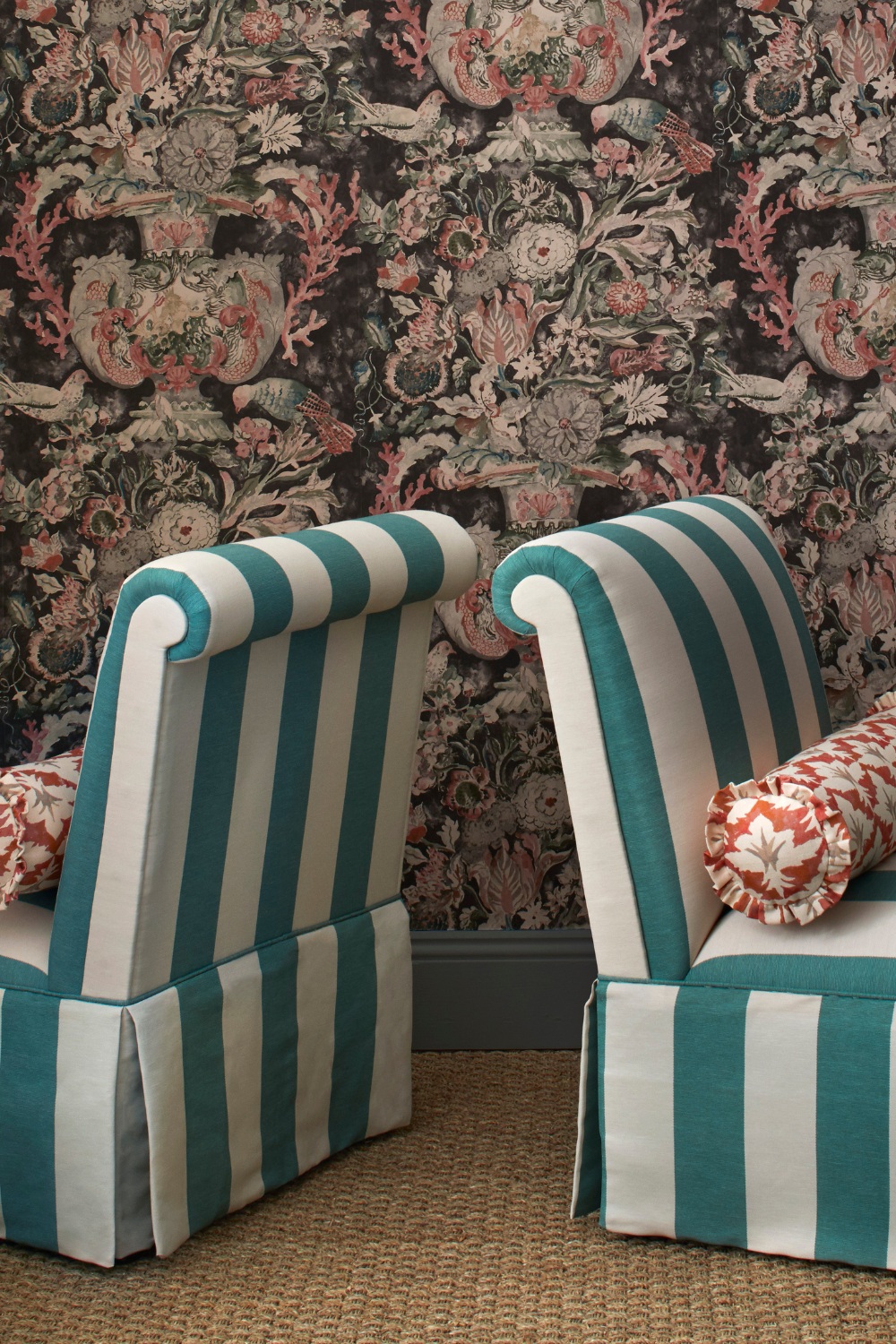 Striped chairs in front of floral walls