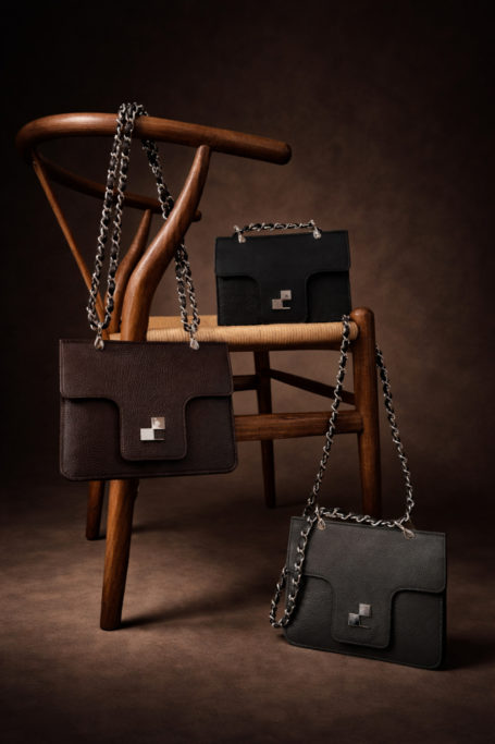 E.P.Brown handbags set on and around chair