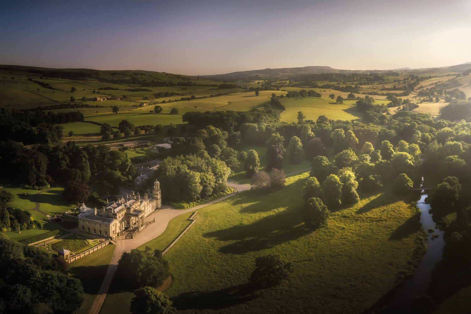 wide angle shot of Broughton Hall surrounded by Yorkshire countryside