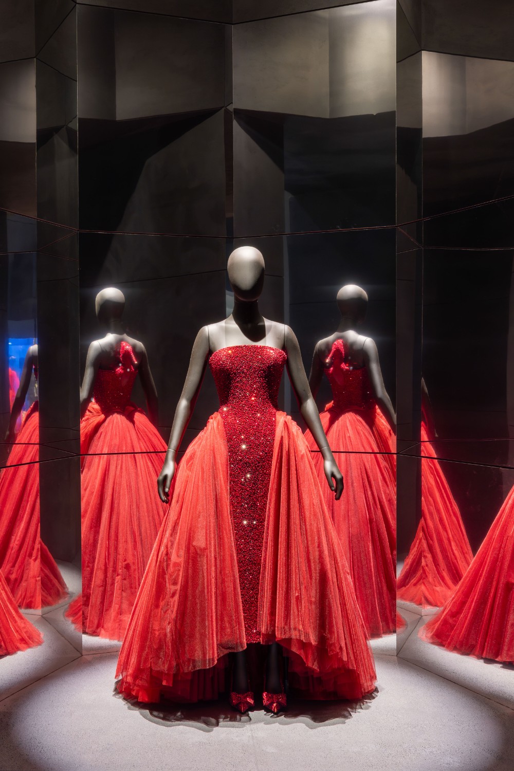 Red dress surrounded by mirrors