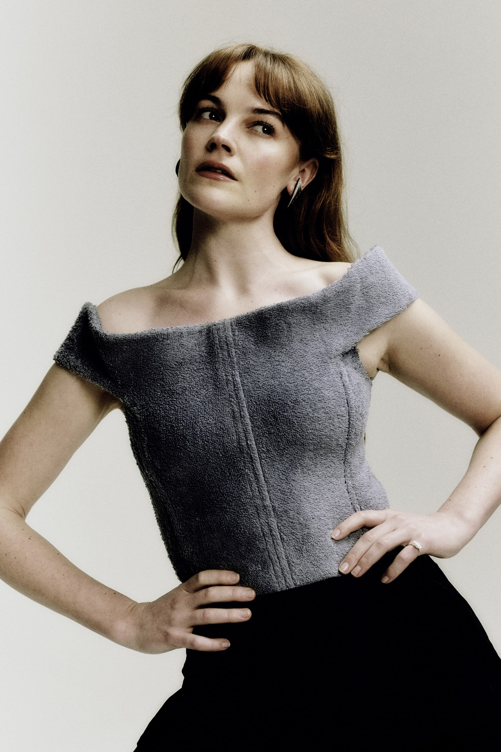 Izzy Meikle-Small in a grey bardot top