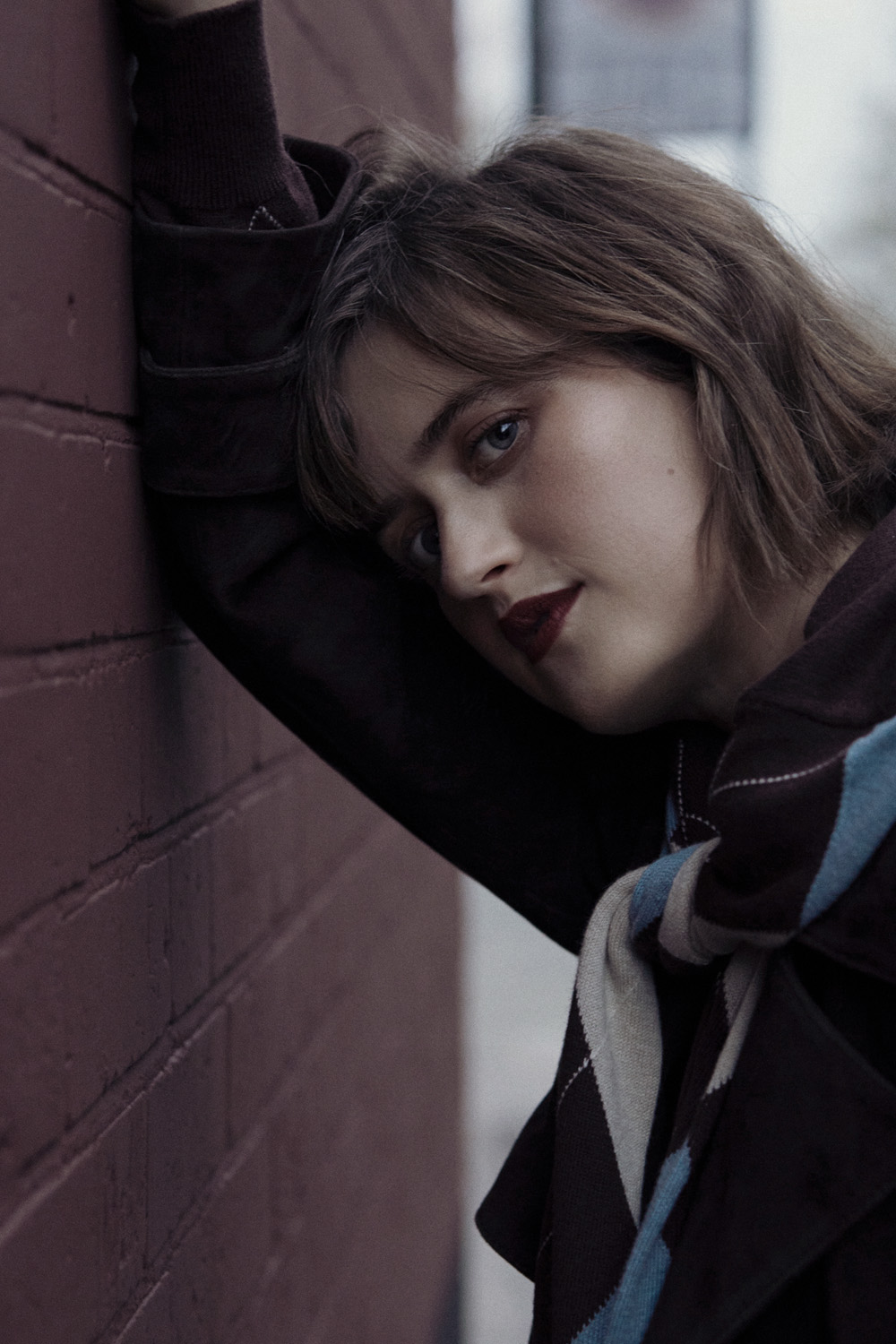 Ella Bruccoleri leaning against a wall