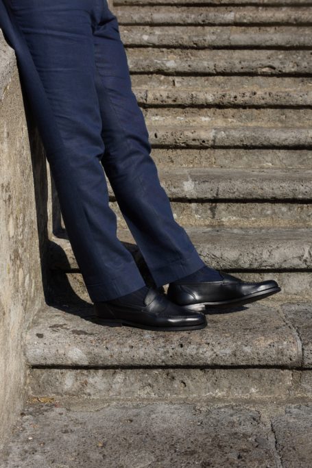 Person leaning on steps