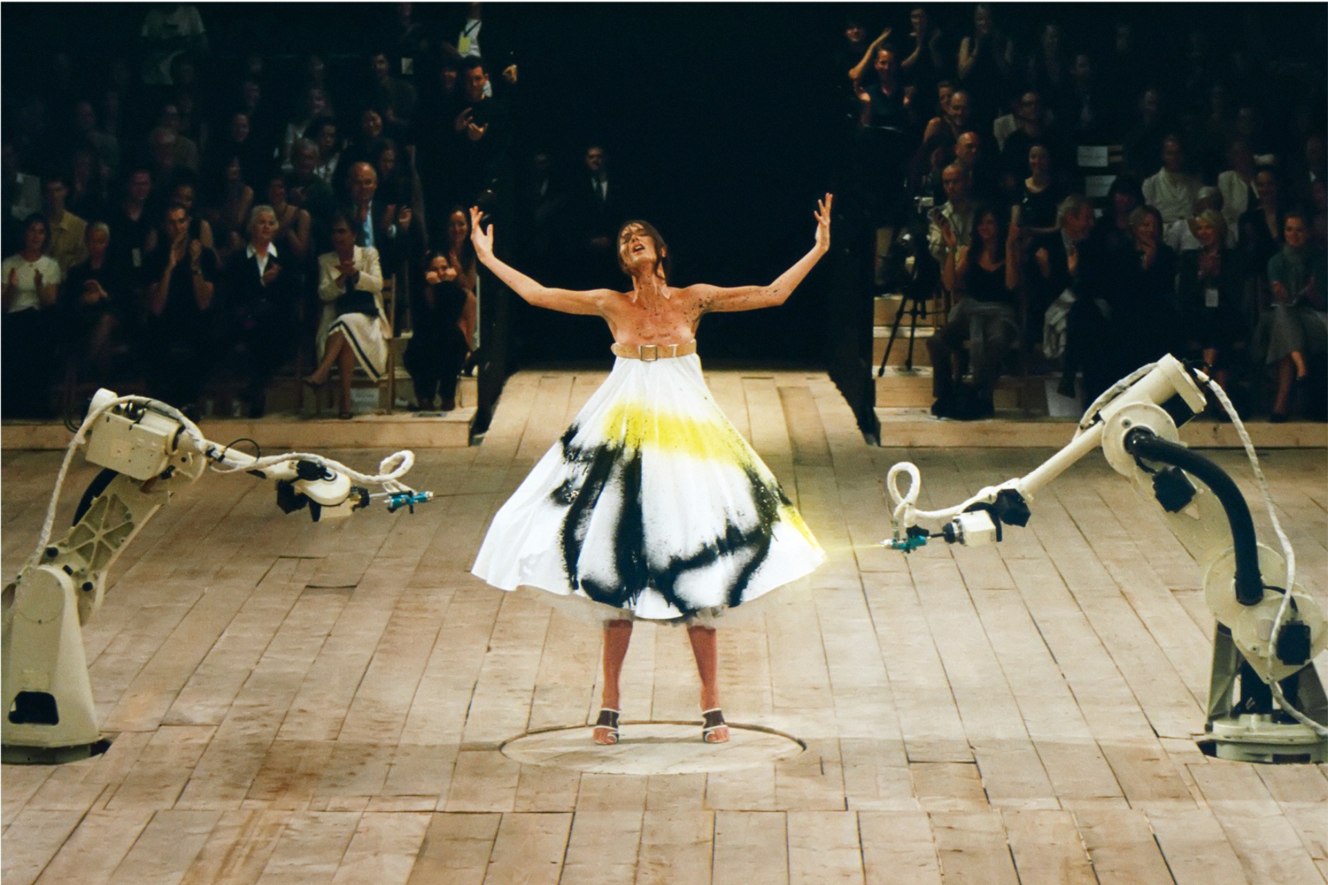 Woman being painted on catwalk | global fashion exhibitions