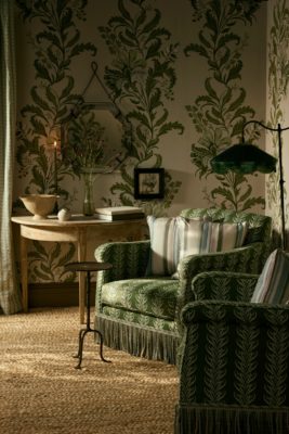 Room with green wallpaper by British wallpaper brand CINNY