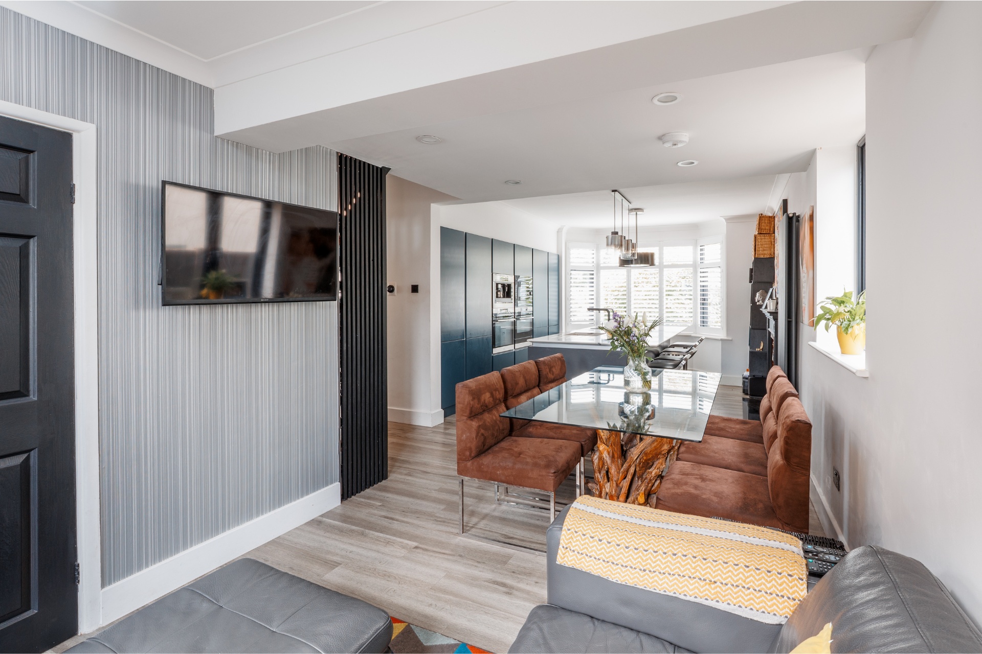 View of open plan seating area and kitchen