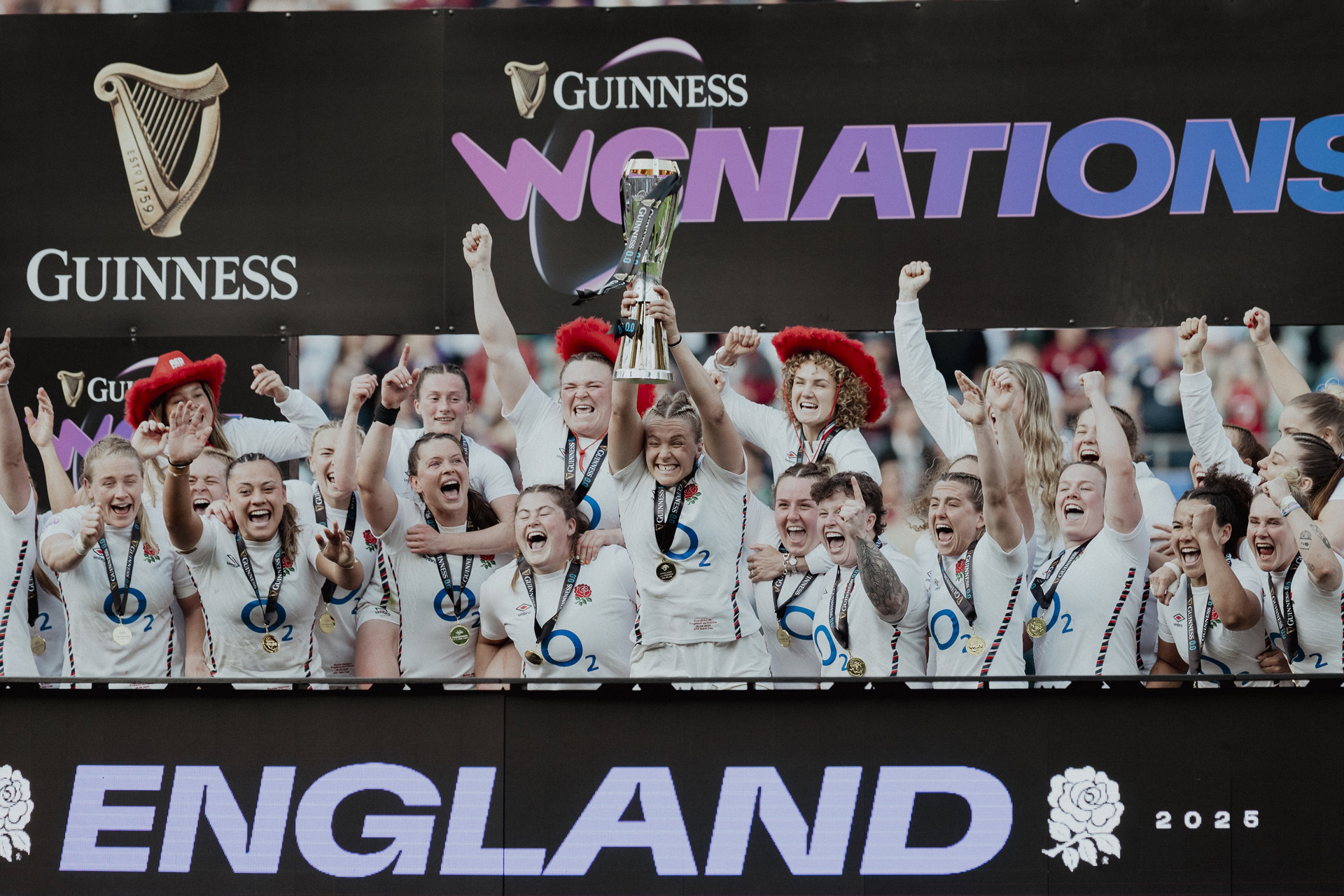 Zoe Aldcroft of England lifts the Guinness Women's Six Nations trophy, after England defeated France to secure a Grand Slam and be crowned as Six Nations Champions, after the Guinness Women's Six Nations 2025 match between England and France at Allianz Stadium on April 26, 2025 in London, England.