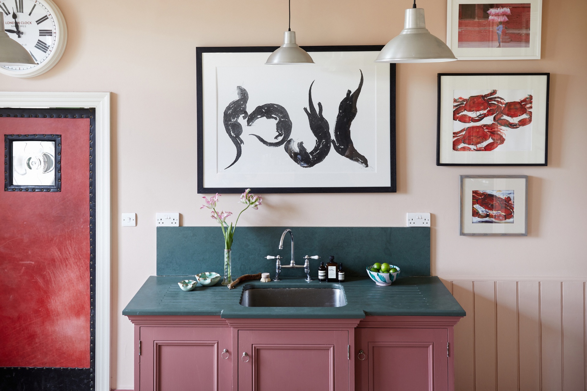 Pink bathroom vanity with grey marble counter