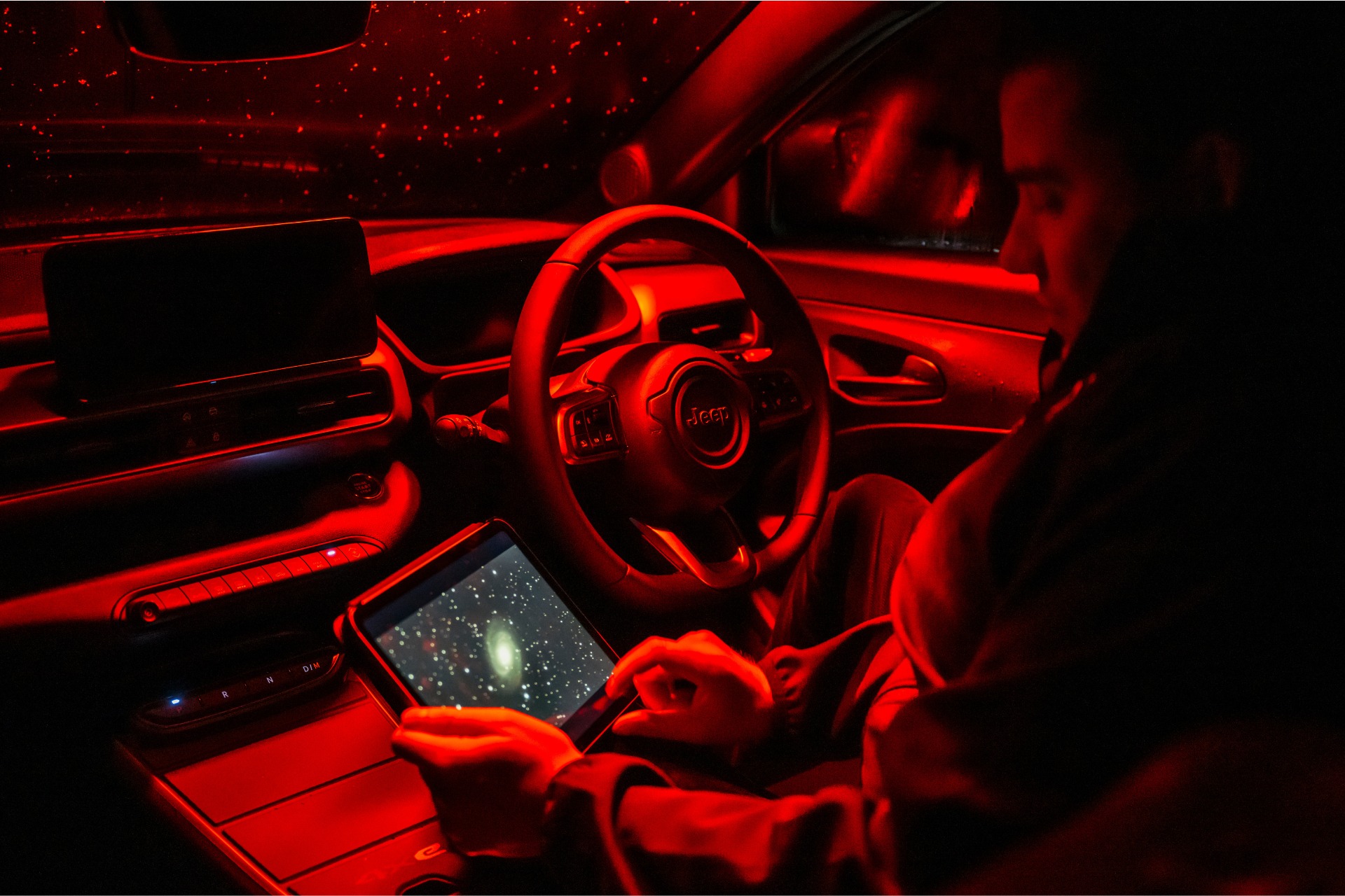 People on tablet in car