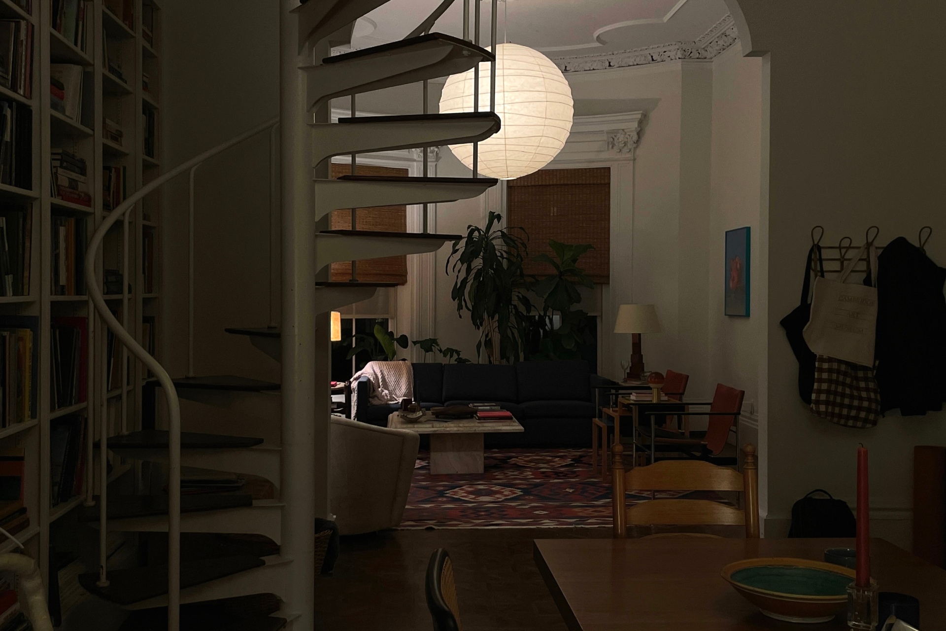 Low lit apartment with spiral staircase