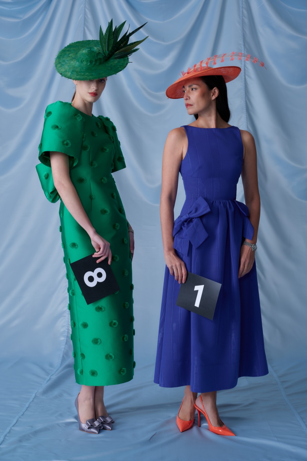 Woman in green and blue dresses