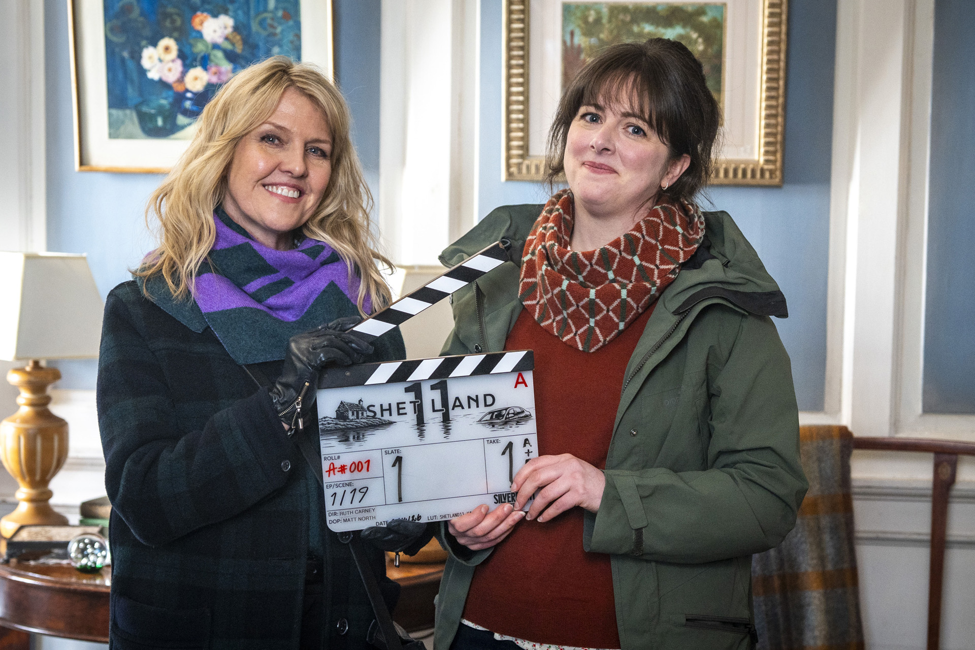 Ashley Jensen & Alison O'Donnell holding a clapperboard