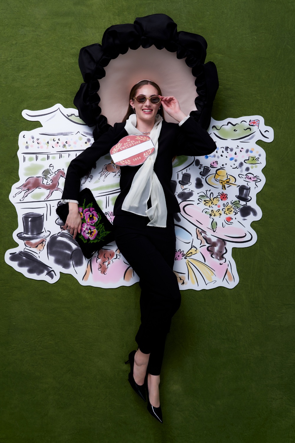 Woman in black suit and hat