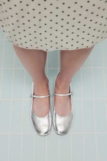 Close up of feet in silver shoes