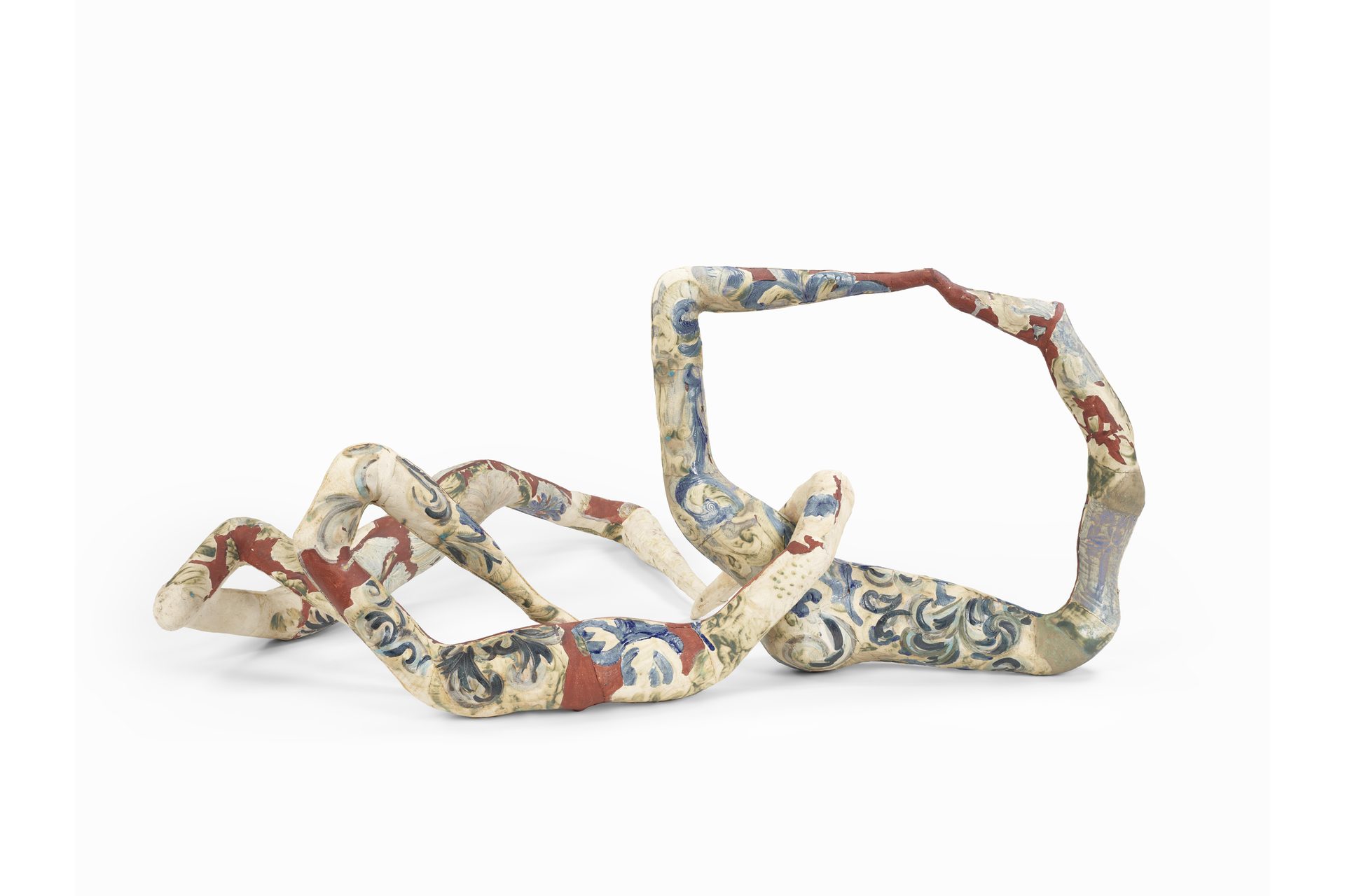 A strange clay sculpture with a colourful patterned surface