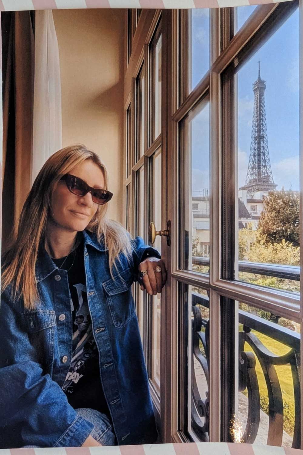 woman sitting on the window seat at Shangri-La Paris