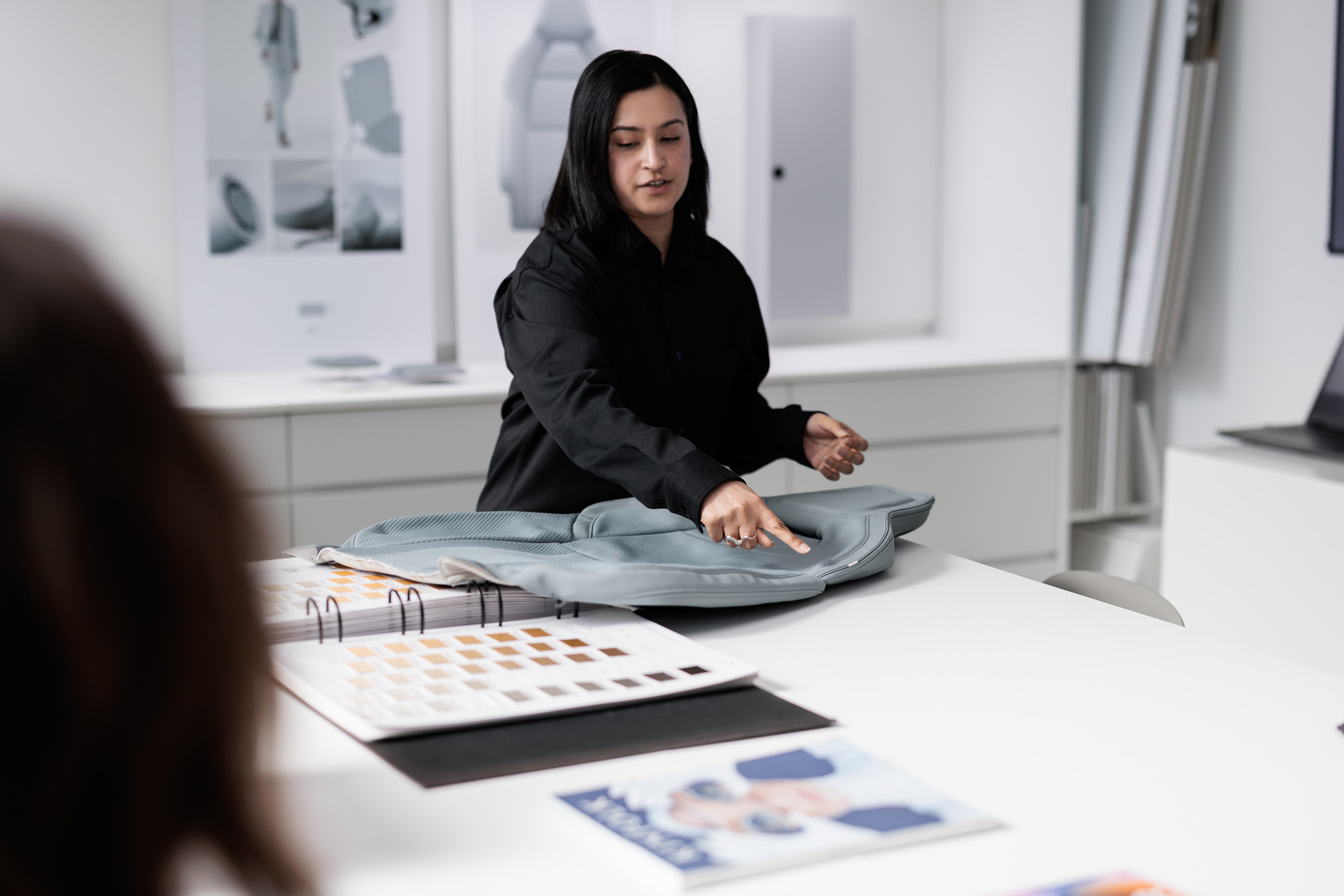 Woman looking at designs at Polestar Mission House in Gothenburg