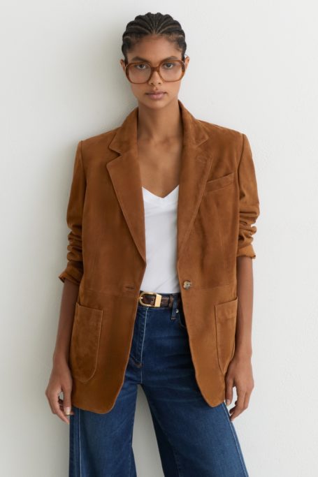 Woman wearing brown suede blazer